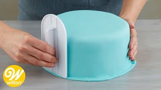 How to Cover a Round Cake with Fondant  Wilton [upl. by Aviva]