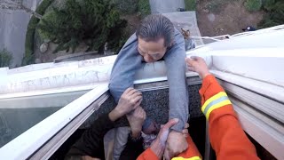 Firefighter Saves Man From Falling Out Window [upl. by Lrac681]